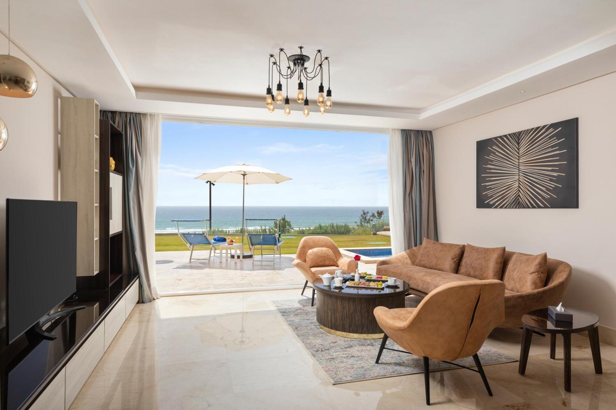 Pickalbatros White Beach Taghazout (Adults Only) Eksteriør billede A living room in a villa at the resort